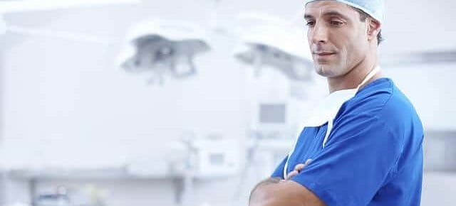 dr after surgery with folded arms and scrubs