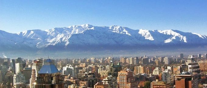 picture of city with mountains in background
