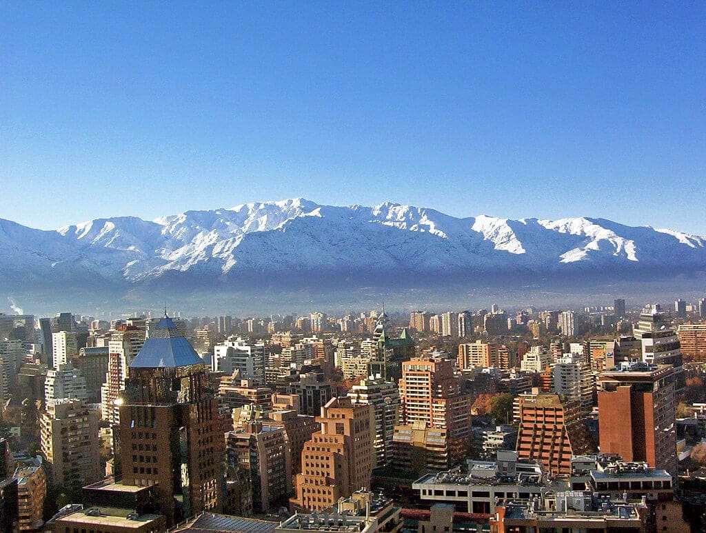 picture of city with mountains in background