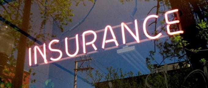 glass window of building with insurance light on