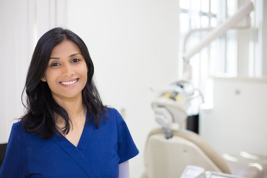 dental hygienist smiling at camera