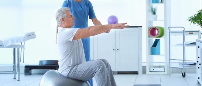 Physiotherapist working with patient in clinic