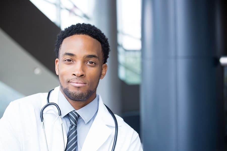 black young male Dr looking at camera