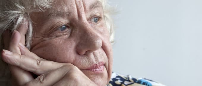 pensive looking older woman