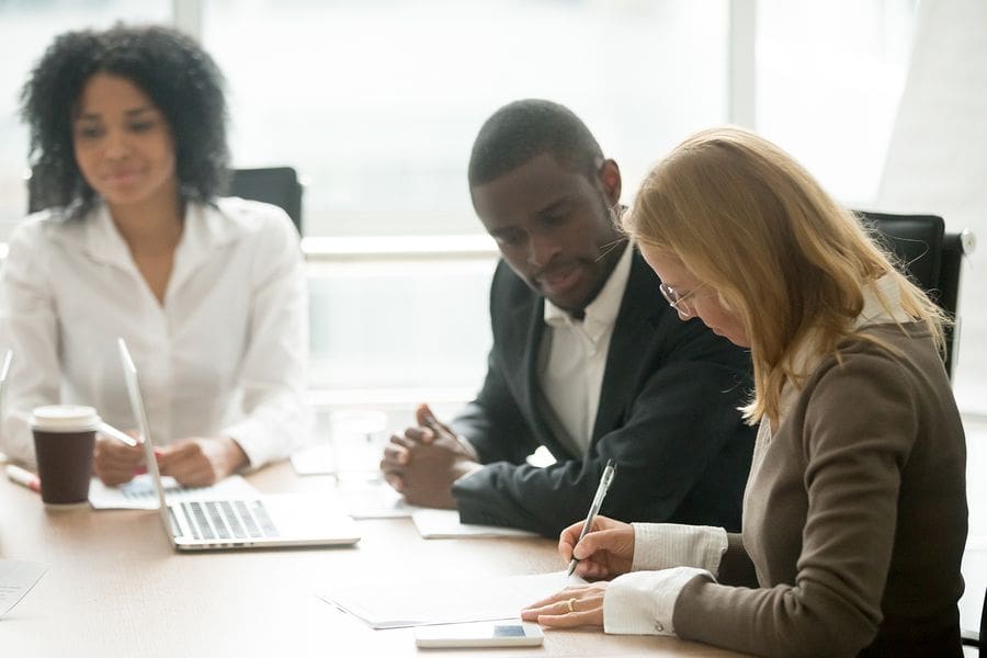 Office with three business professionals working