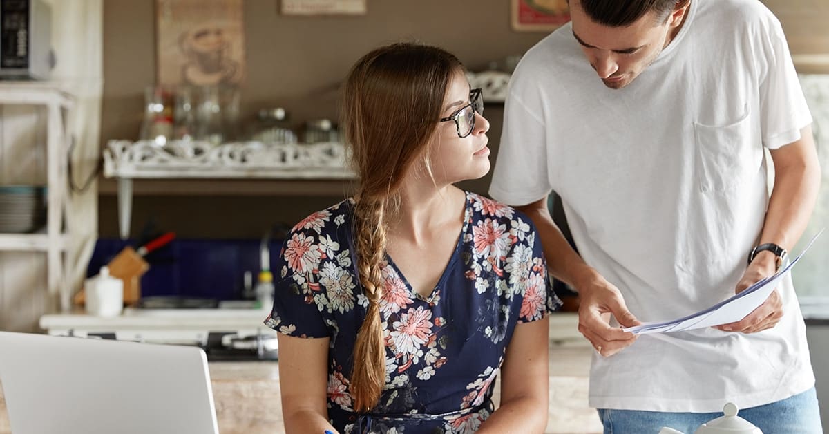 young couple paying bills together