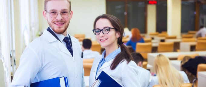 male and female med students in class
