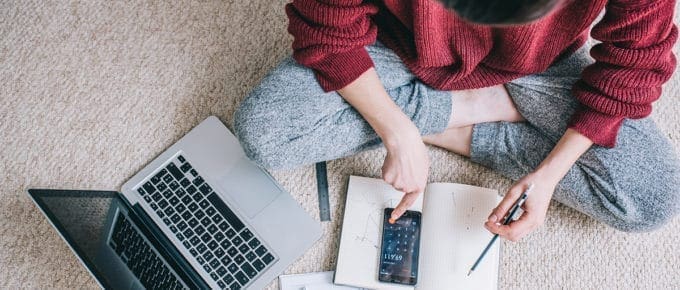 woman laptop budget overhead view