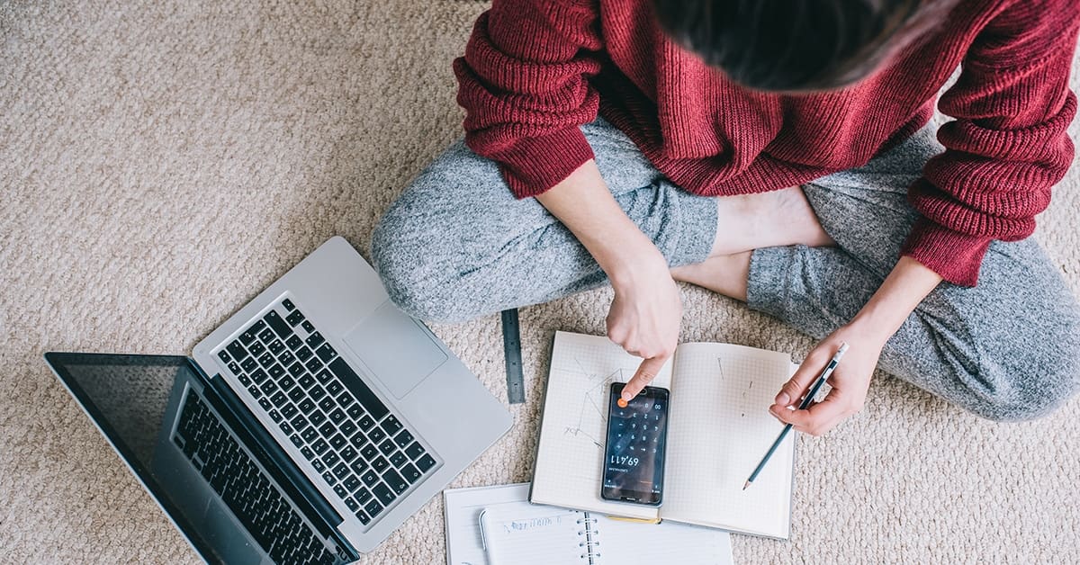 woman laptop budget overhead view