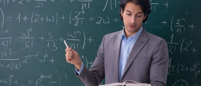 male science teacher using blackboard