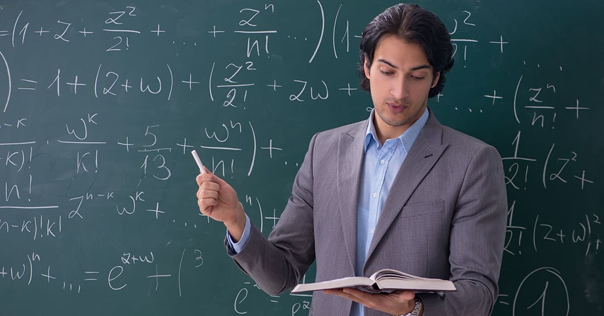 male science teacher using blackboard