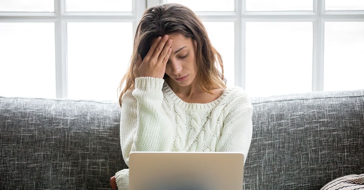 stressed young woman with laptop