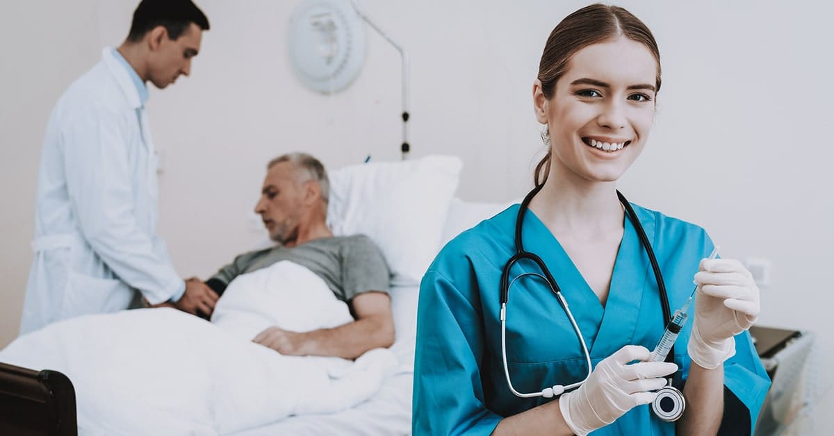 female nurse smiling with doctor talking with patient