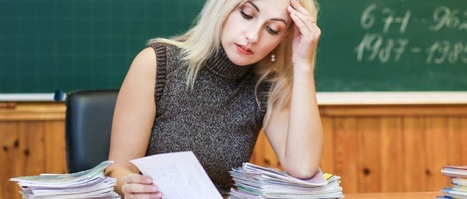 young-female-teacher-stressed-over-work