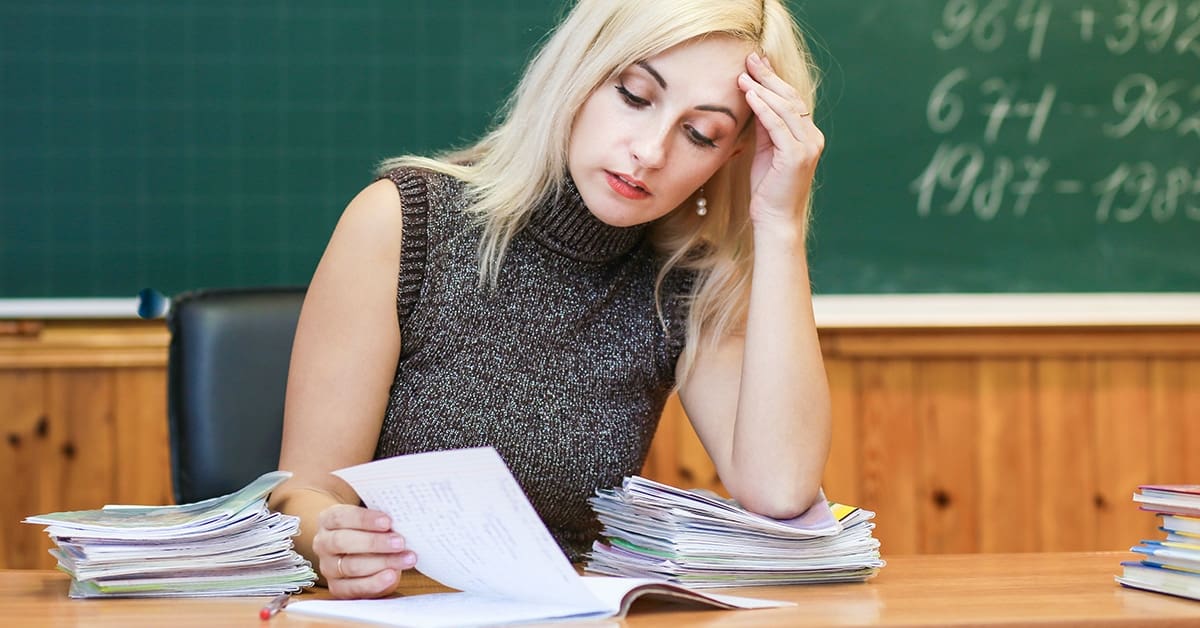 young-female-teacher-stressed-over-work