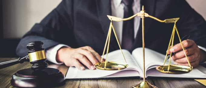 lawyer-writing-law-balance-scale-gavel