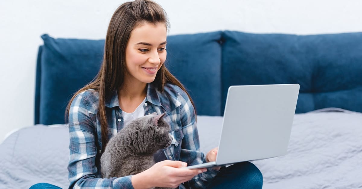 young-woman-laptop-cat-sitting-lap