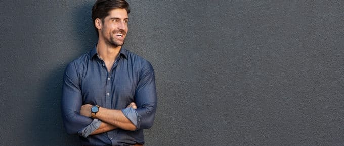 smiling-professional-man-gray-background