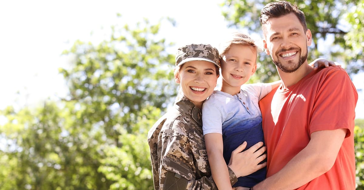 military-family-female-service-member-husband-son-smiling-park