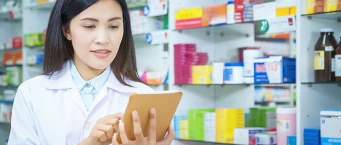 young-woman-pharmacist-using-tablet-medicine