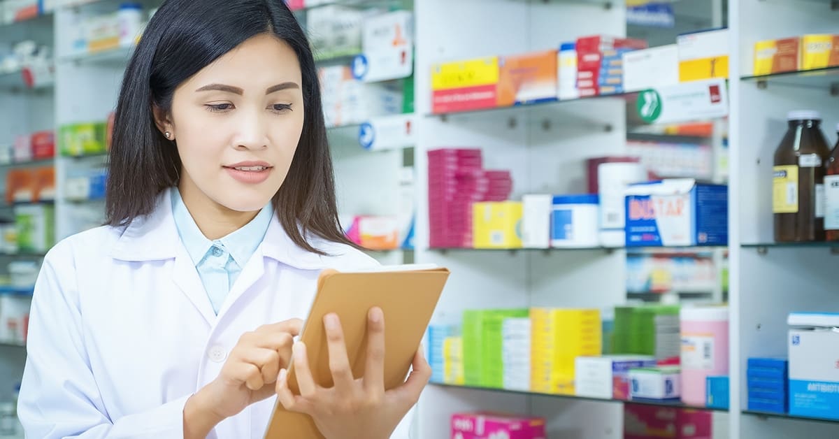 young-woman-pharmacist-using-tablet-medicine