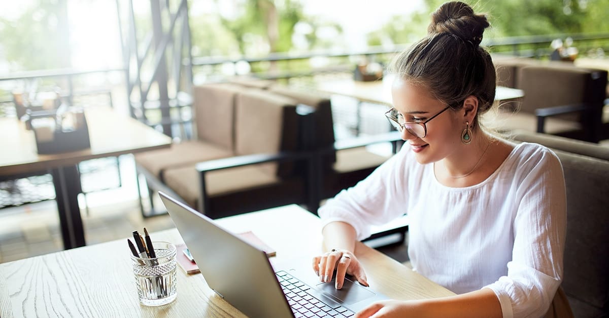 young-woman-working-laptop-cafe