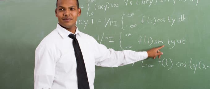 male-teacher-pointing-blackboard-math-equations