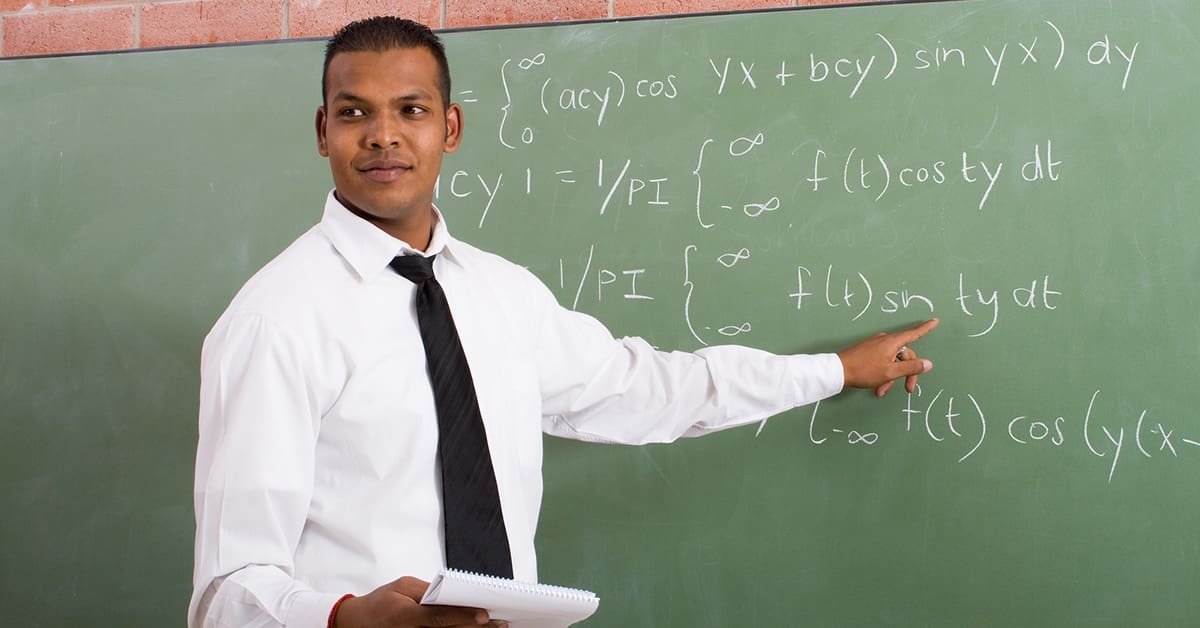 male-teacher-pointing-blackboard-math-equations