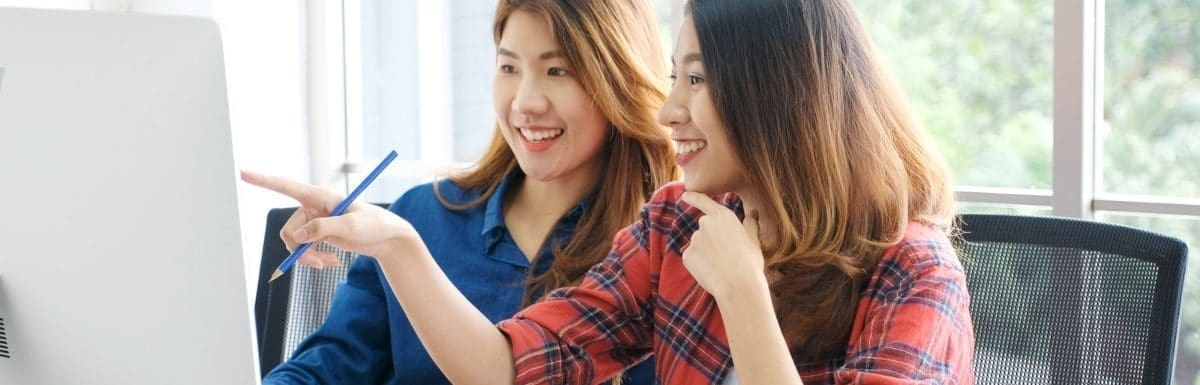 asian females staring at computer