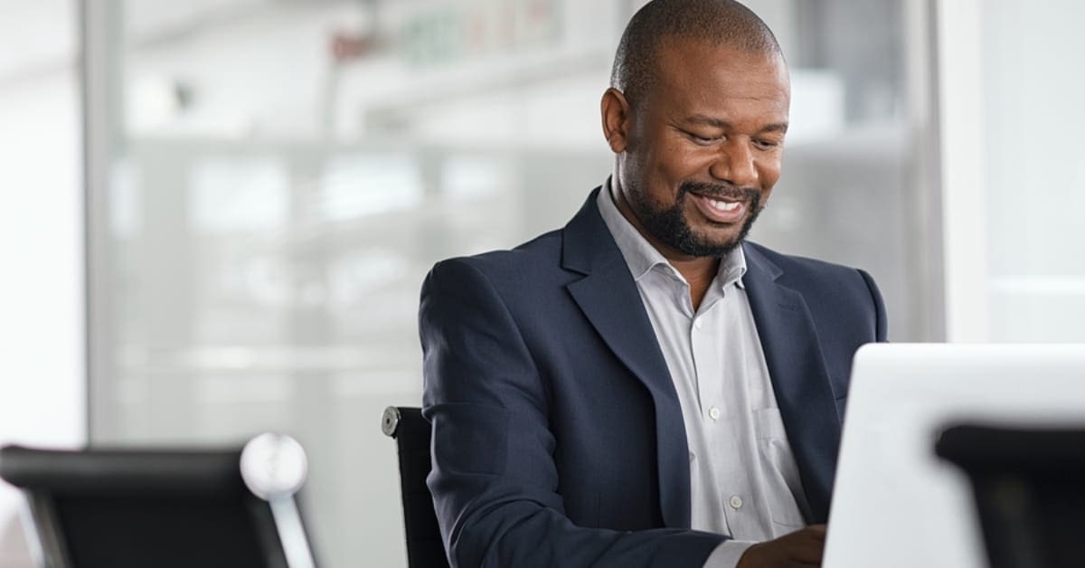 Professional Male Typing at Workplace