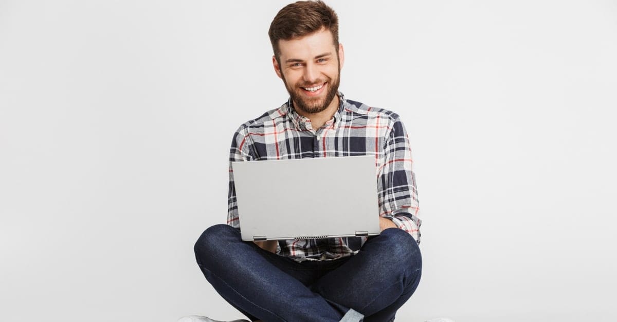 Man Sitting with Laptop