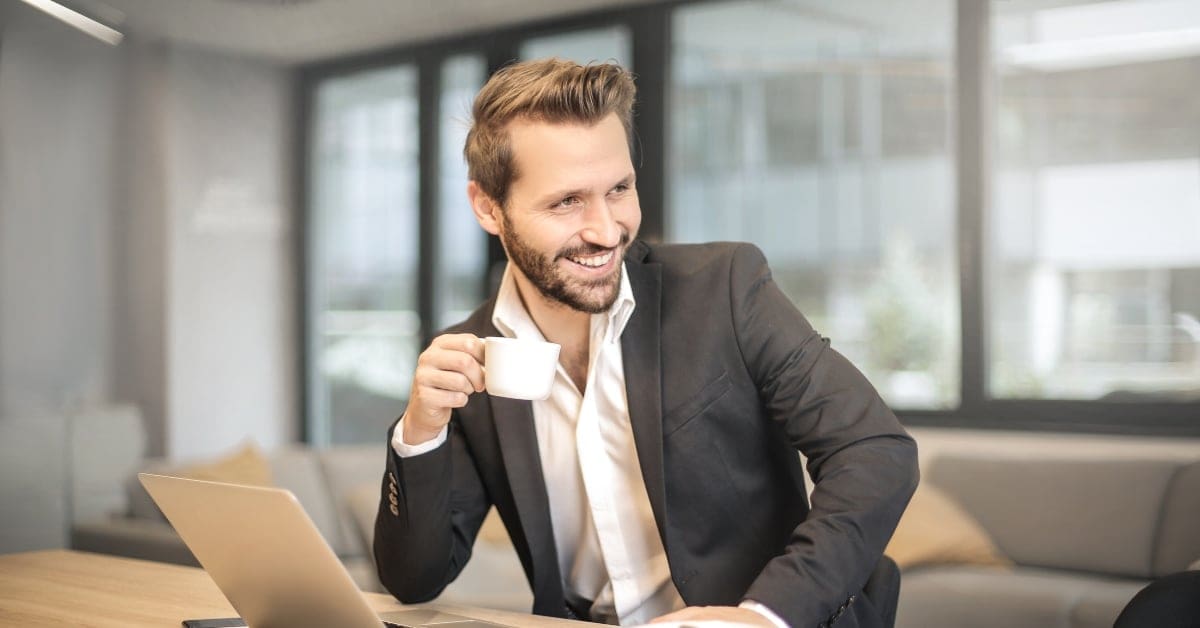 Man with Espresso Cup in Business Attire