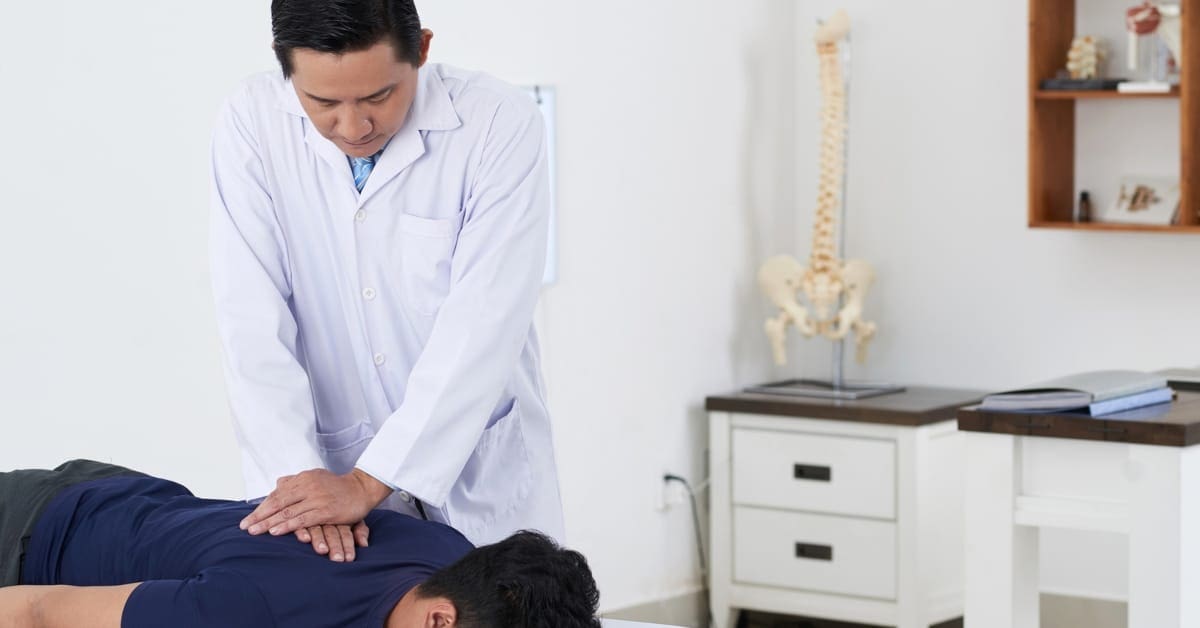 Chiropractic Compressing on Patient