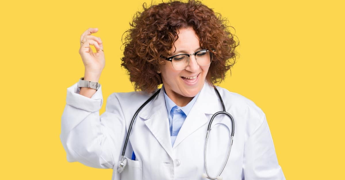 Female Physician with Curly Hair Smiling