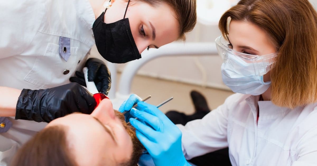 Dental Professionals Working on Patient