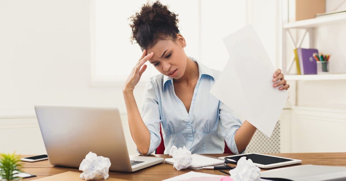 Woman Stressed While on Laptop