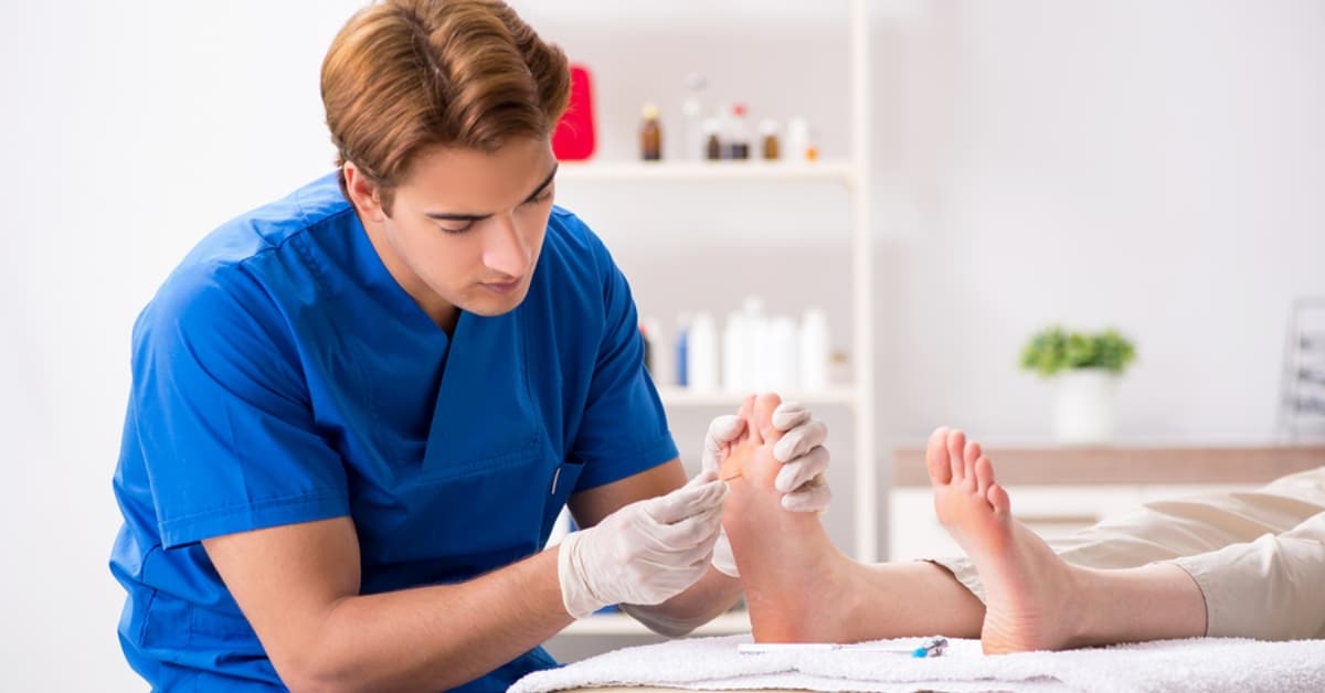 Podiatrist Working on Patient's Feet