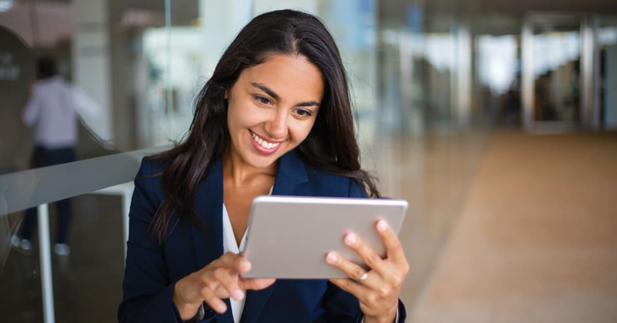 SoFi vs. Laurel Road - Woman in Blazer on Tablet