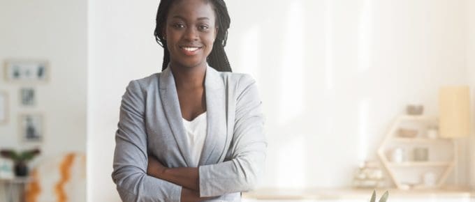 African American Professional Woman in Office Smiling