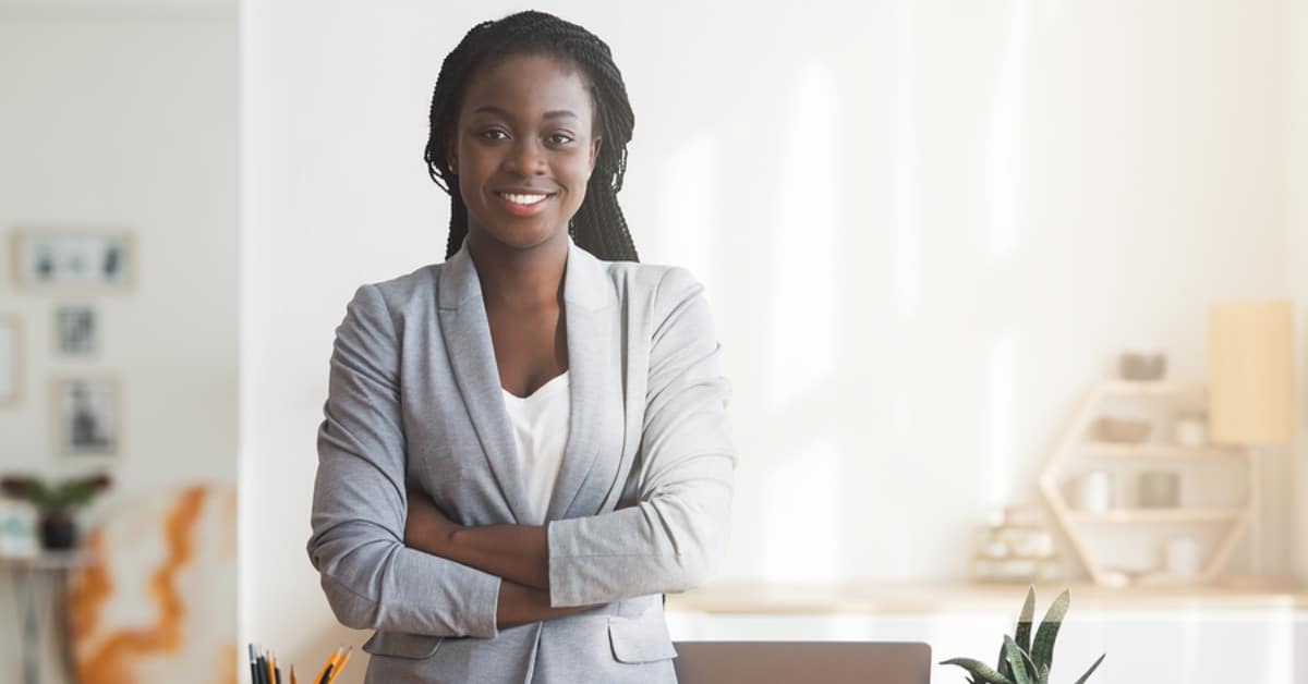 African American Professional Woman in Office Smiling
