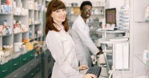 Woman and Man Pharmacy Workers Posing for Picture