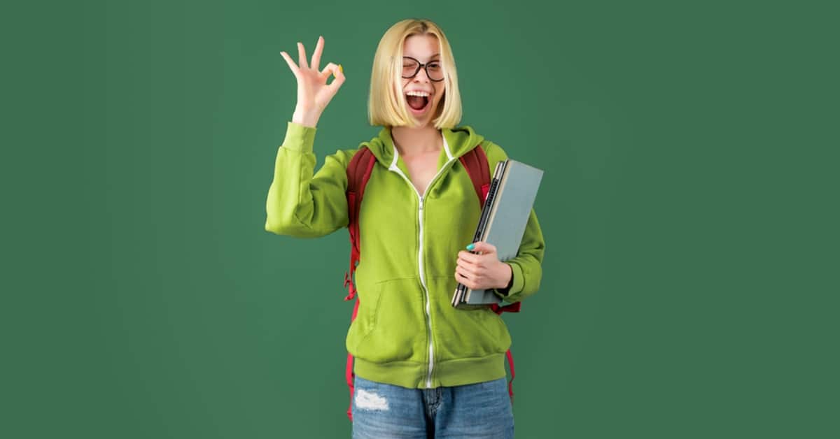 Woman Smiling with A-Okay Hand Sign Wearing Backpack