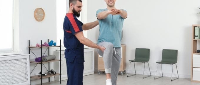 Physical Therapist Assisting Patient