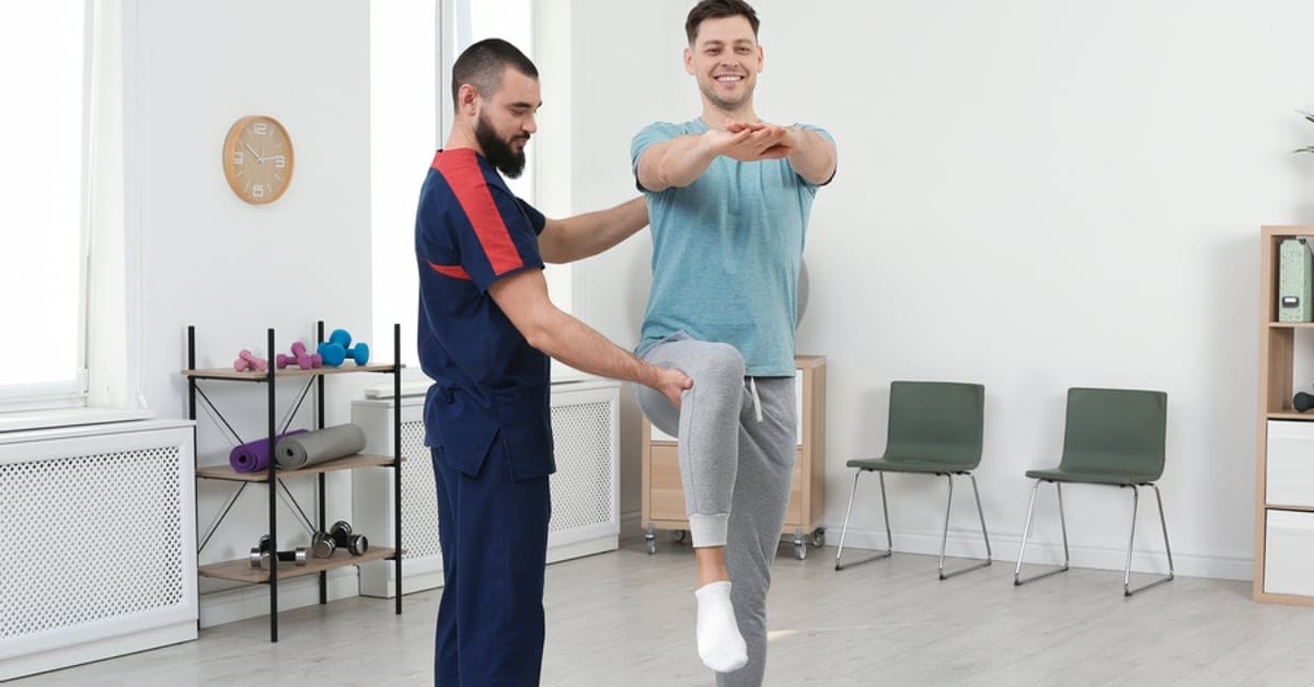 Physical Therapist Assisting Patient