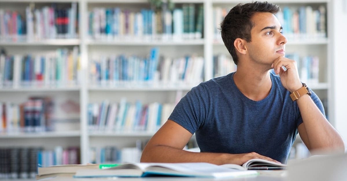 Man Pondering in Library