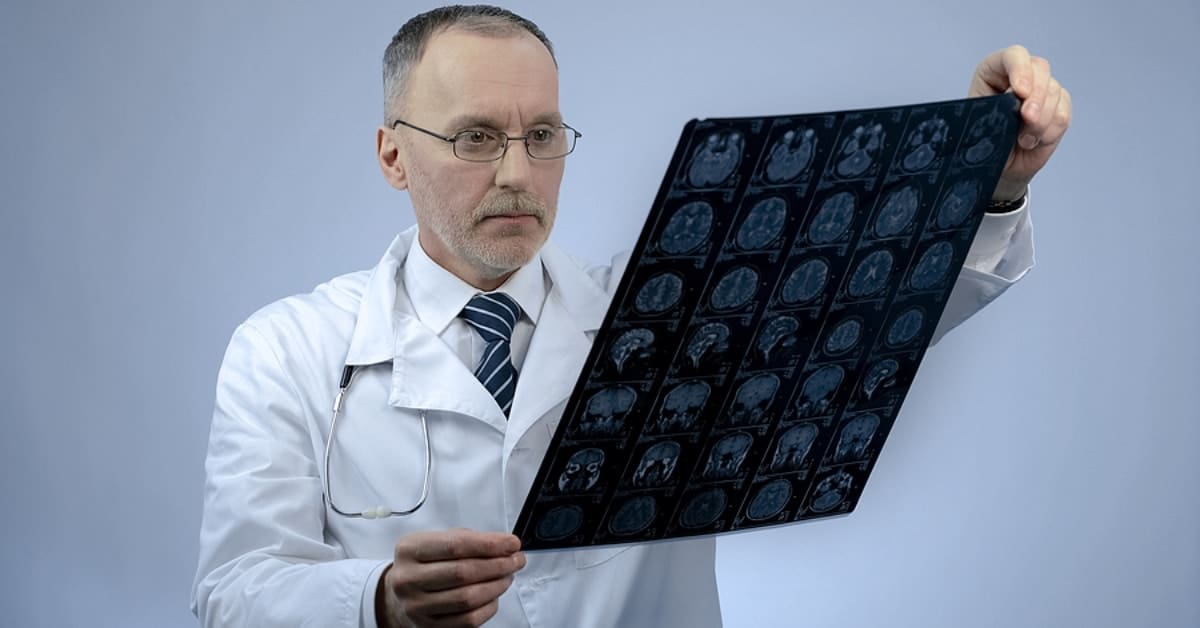 Neurosurgeon Examining Scan