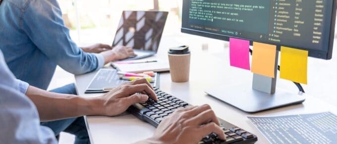 Hands Typing at Keyboard