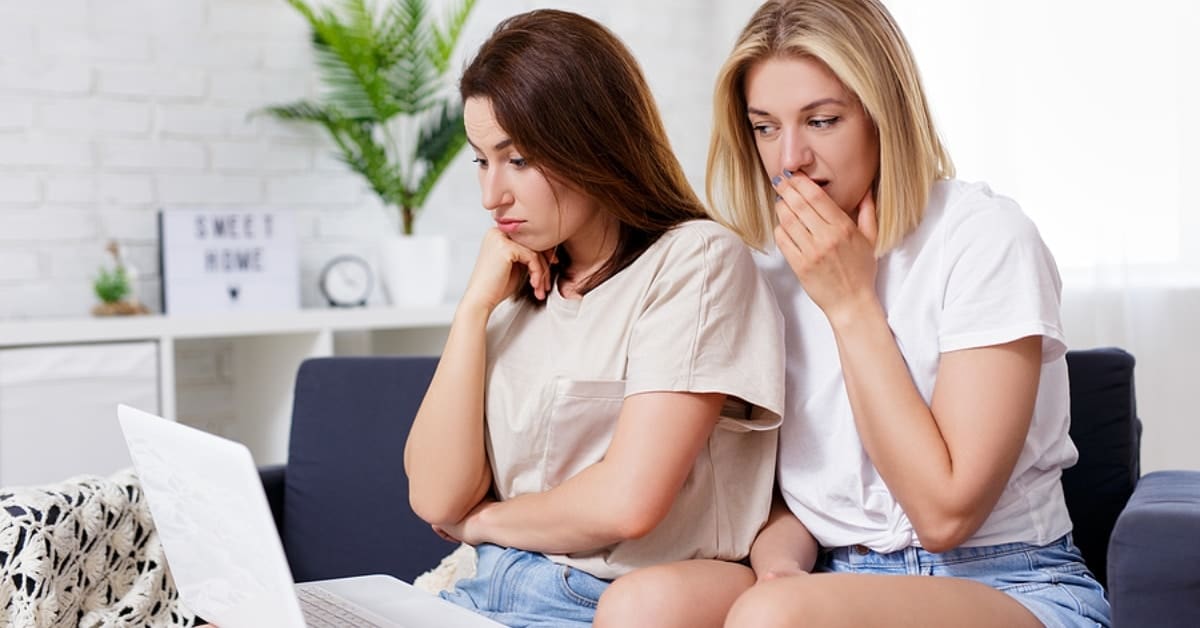 Two Women Disgruntled Looking at Laptop