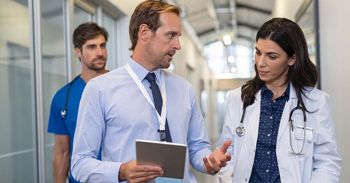 Female Doctor and Man Walking and Talking