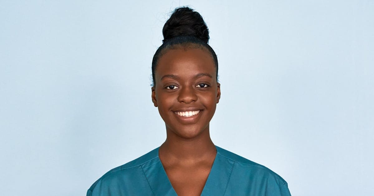 African American Woman in Scrubs Smiling